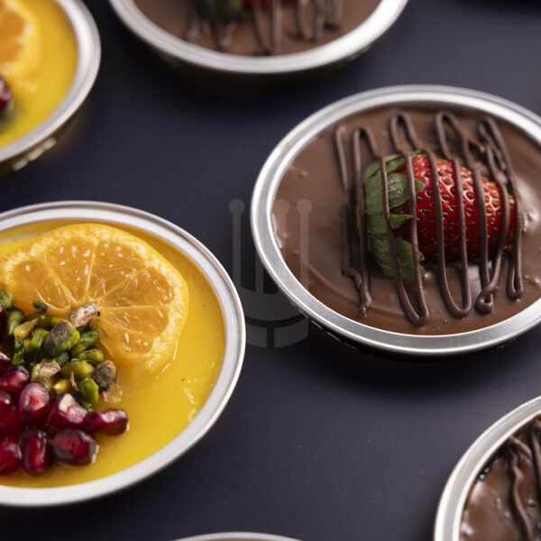 Kahraman Catering Cheescake with blueberry topped with Orange , Lemon, Strawberry, Cherries puree & Chocolate