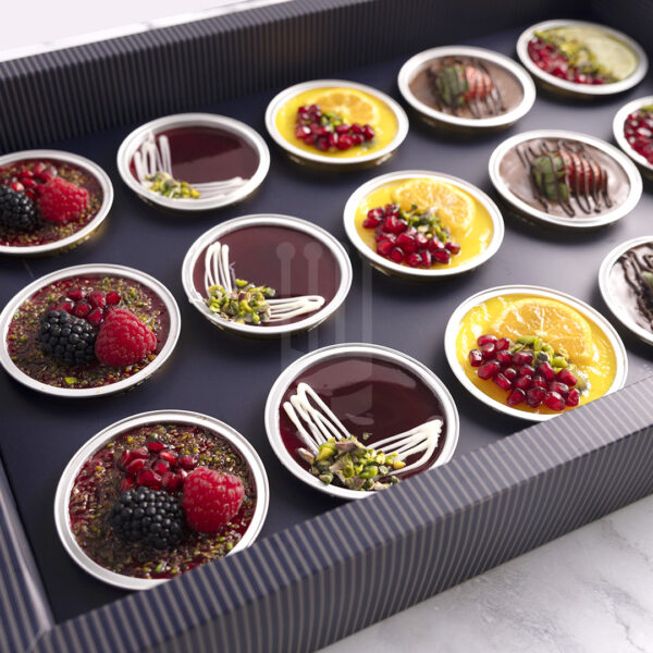 Kahraman Catering Cheescake with blueberry topped with Orange , Lemon, Strawberry, Cherries puree & Chocolate