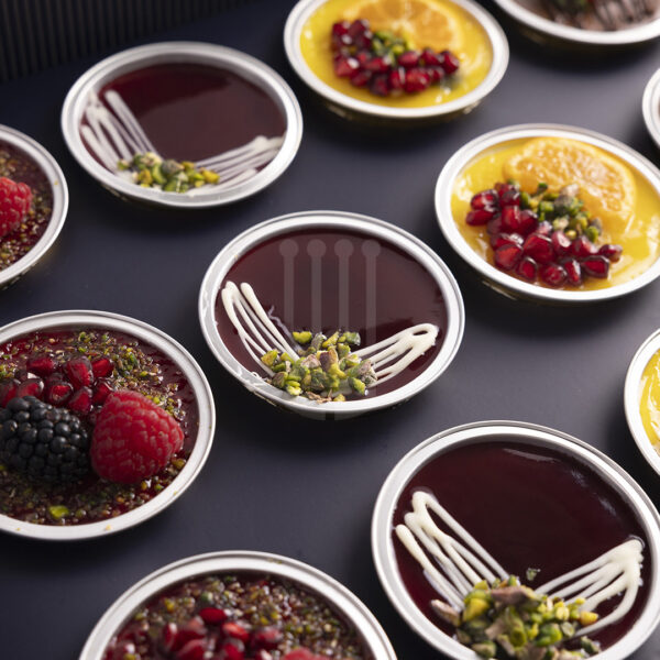 Kahraman Catering Cheescake with blueberry topped with Orange , Lemon, Strawberry, Cherries puree & Chocolate