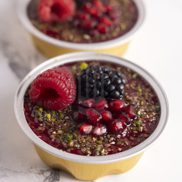 Kahraman Catering Cheescake with blueberry topped with Orange , Lemon, Strawberry, Cherries puree & Chocolate